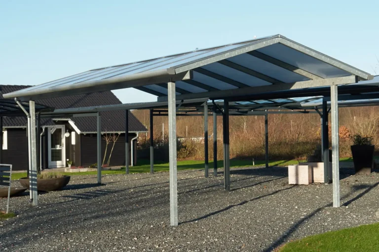 Freestanding gable-roof carport with steel posts and translucent roof panels, custom carports in Boise, Idaho
