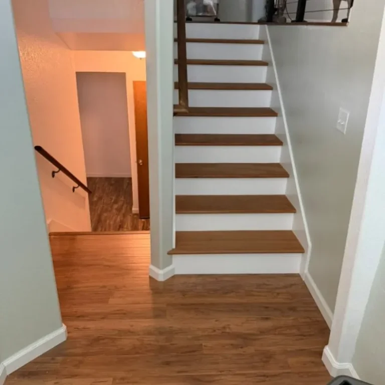 Interior staircase with new wood treads and white risers from a home remodel in Meridian, Idaho