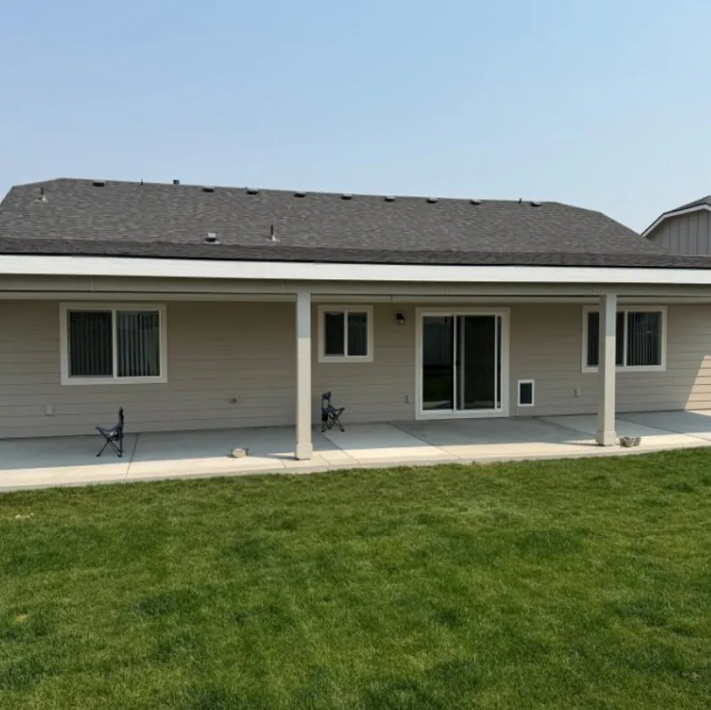 Patio cover over a concrete patio behind a home in Caldwell, Idaho, built by Kemsley Construction