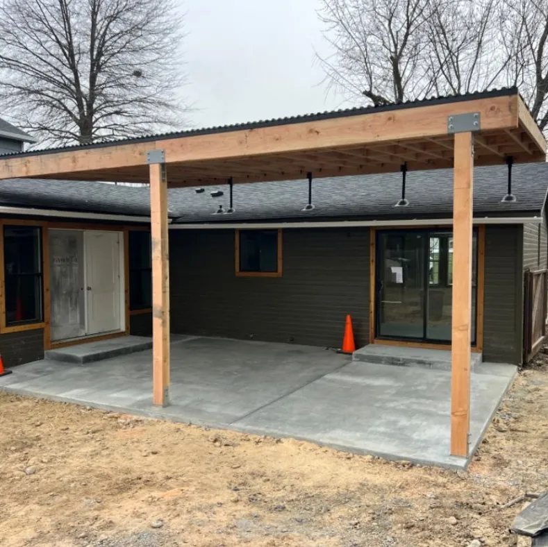 Patio cover with tinted roof panels under construction at a home in Boise, Idaho